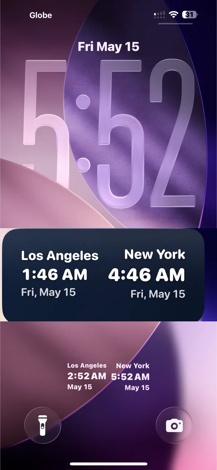iPhone lock screen showing Tripmetic dual clock widget with Los Angeles and New York times